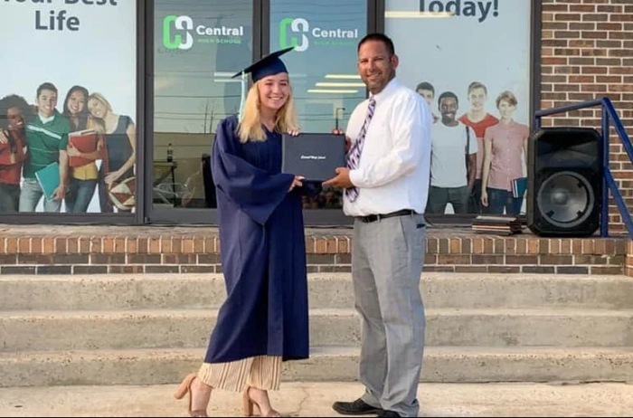 Student graduating with diploma